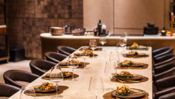 a table topped with plates of food on a counter