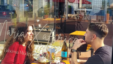 a group of people sitting at a table in a restaurant