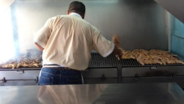 a man cooking in a kitchen