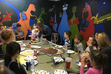 Group of kids having dinosaur theme party