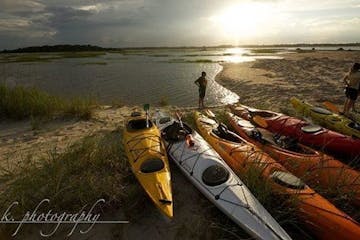 Kayaks parked along shore of Black River in Myrtle Beach, SC