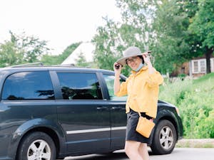 a person standing in front of a car