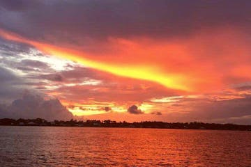 Orange Beach sunset over the water