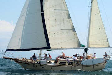 Large sailboat with group aboard