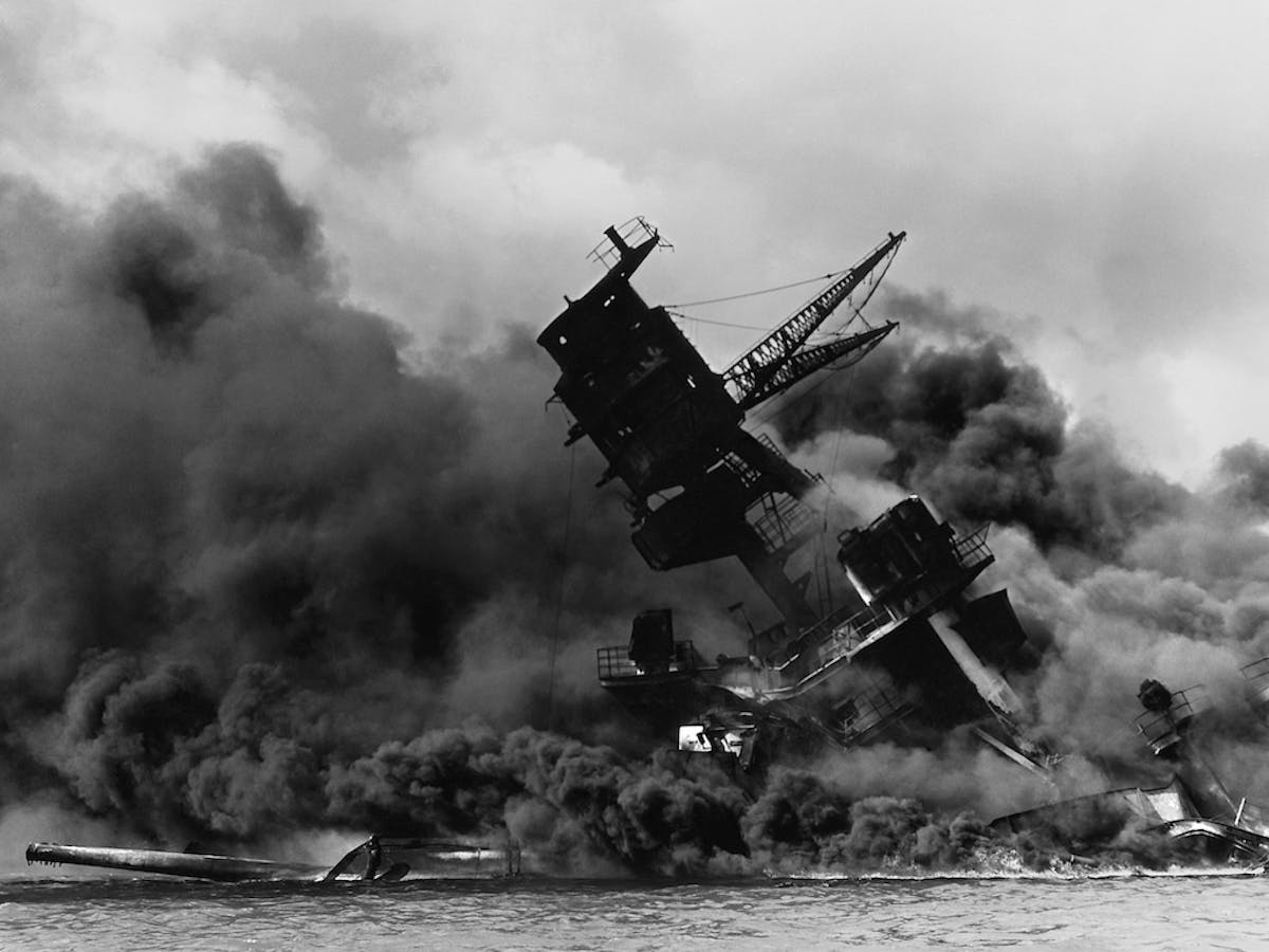 USS Arizona sinking after being attacked by the Japanese Imperial Fleet in a sneak attack on Pearl Harbor on December 7th 1941.