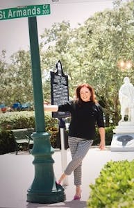 Susan Robinson posing near street sign in Sarasota, FL