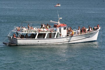 a group of people on a boat in a large body of water