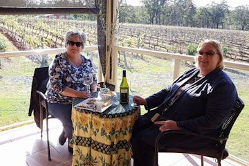 2 girls having a picnic in a winery farm
