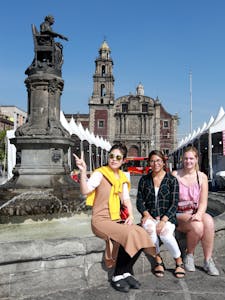 tourists sitting in front of plaza