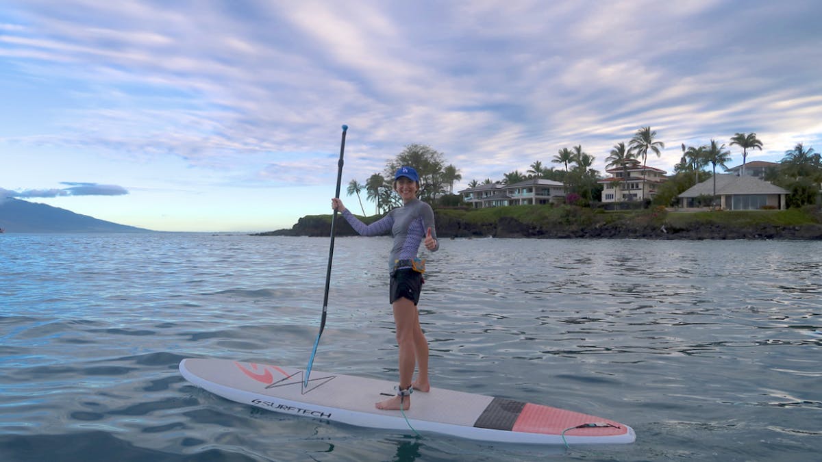 Woman smiling on paddleboard