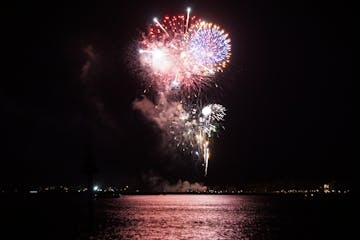 fireworks in the night sky off of hilton head island coast