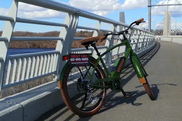 green bike parked on bridge