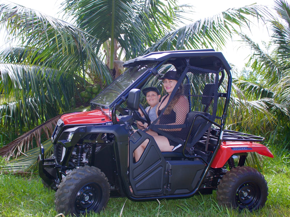 mom and son in ATV