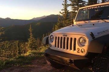 jeep parked in backcountry landscape