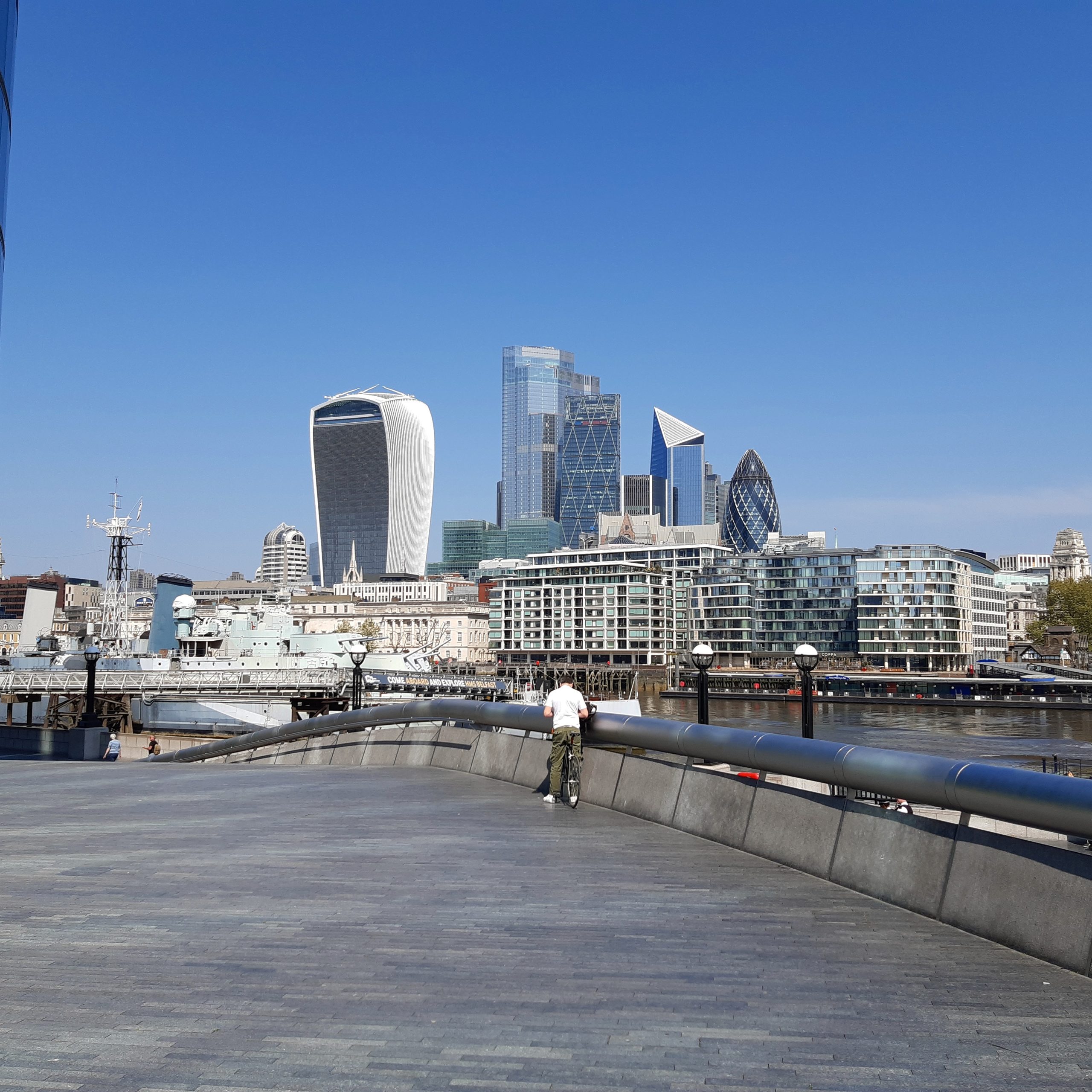 City Skyline: Looking across the River Thames from HMS Belfast to the City of London - London Cab Tours