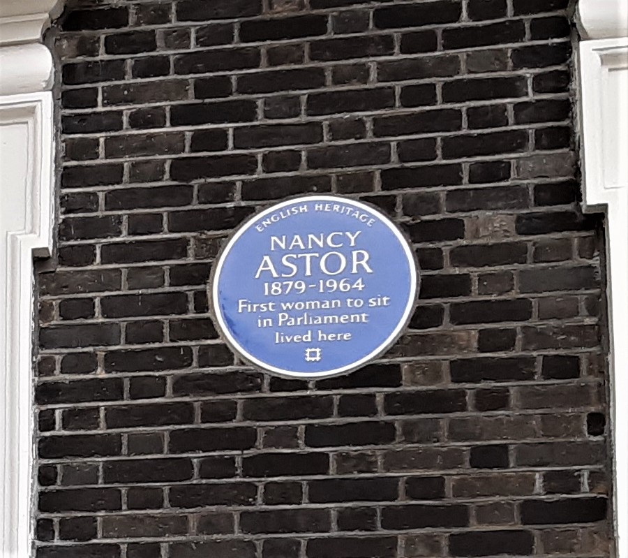 a sign on the side of a brick building