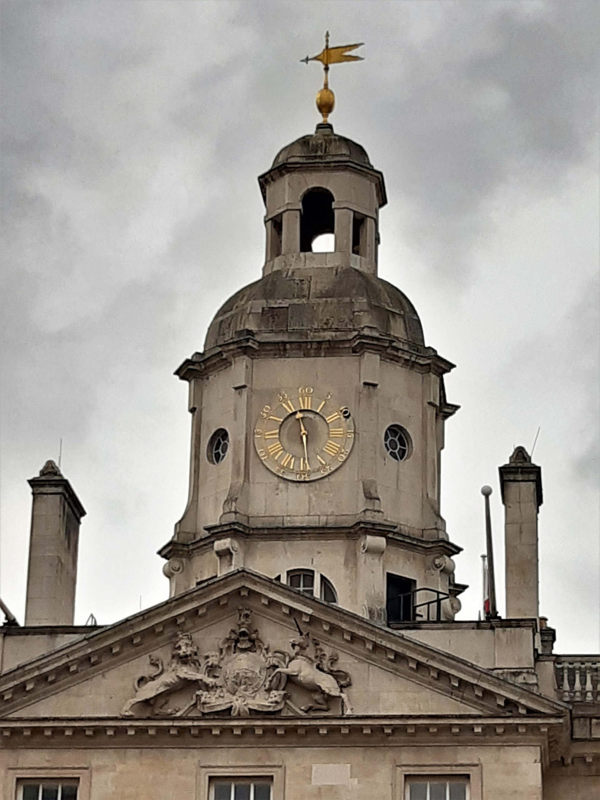 a clock tower in front of a building