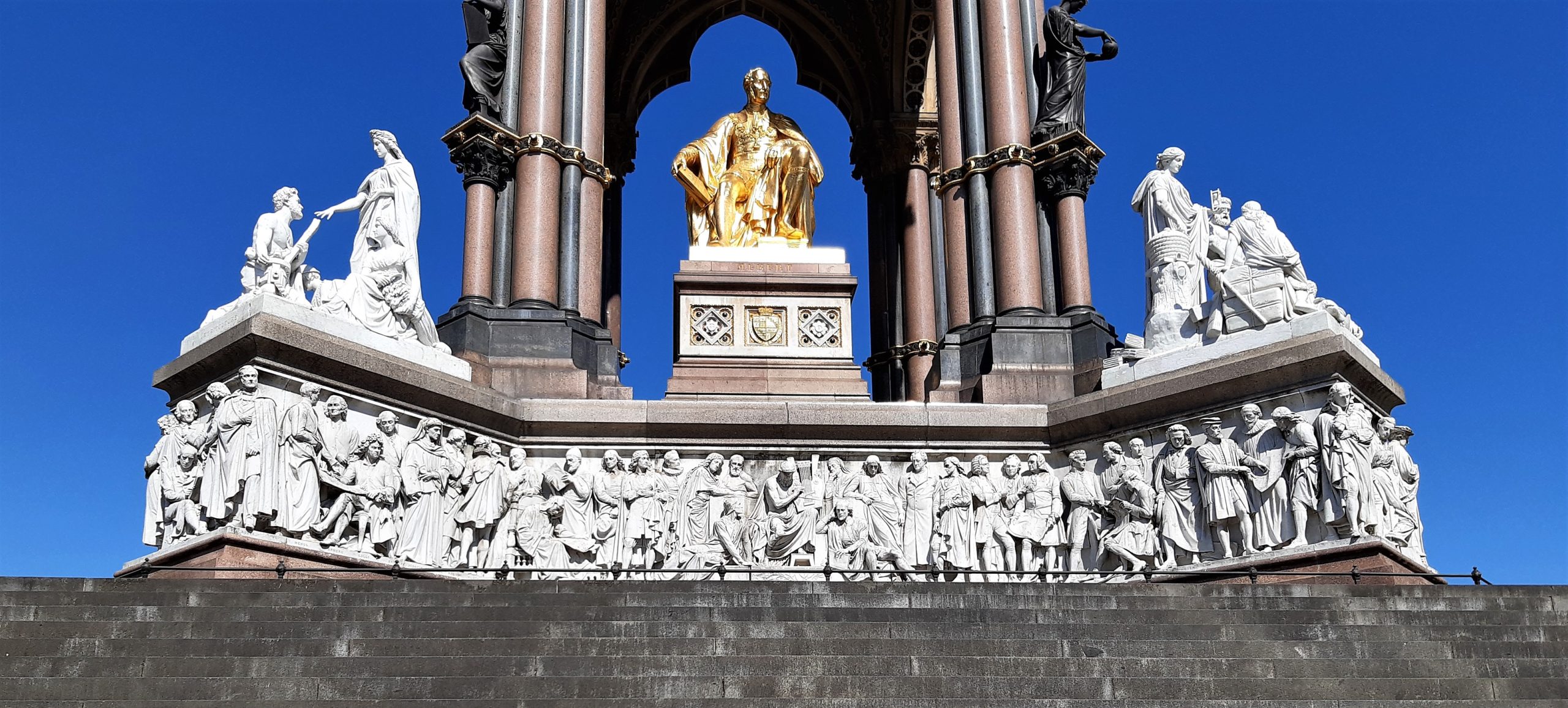 a large stone statue in front of a building