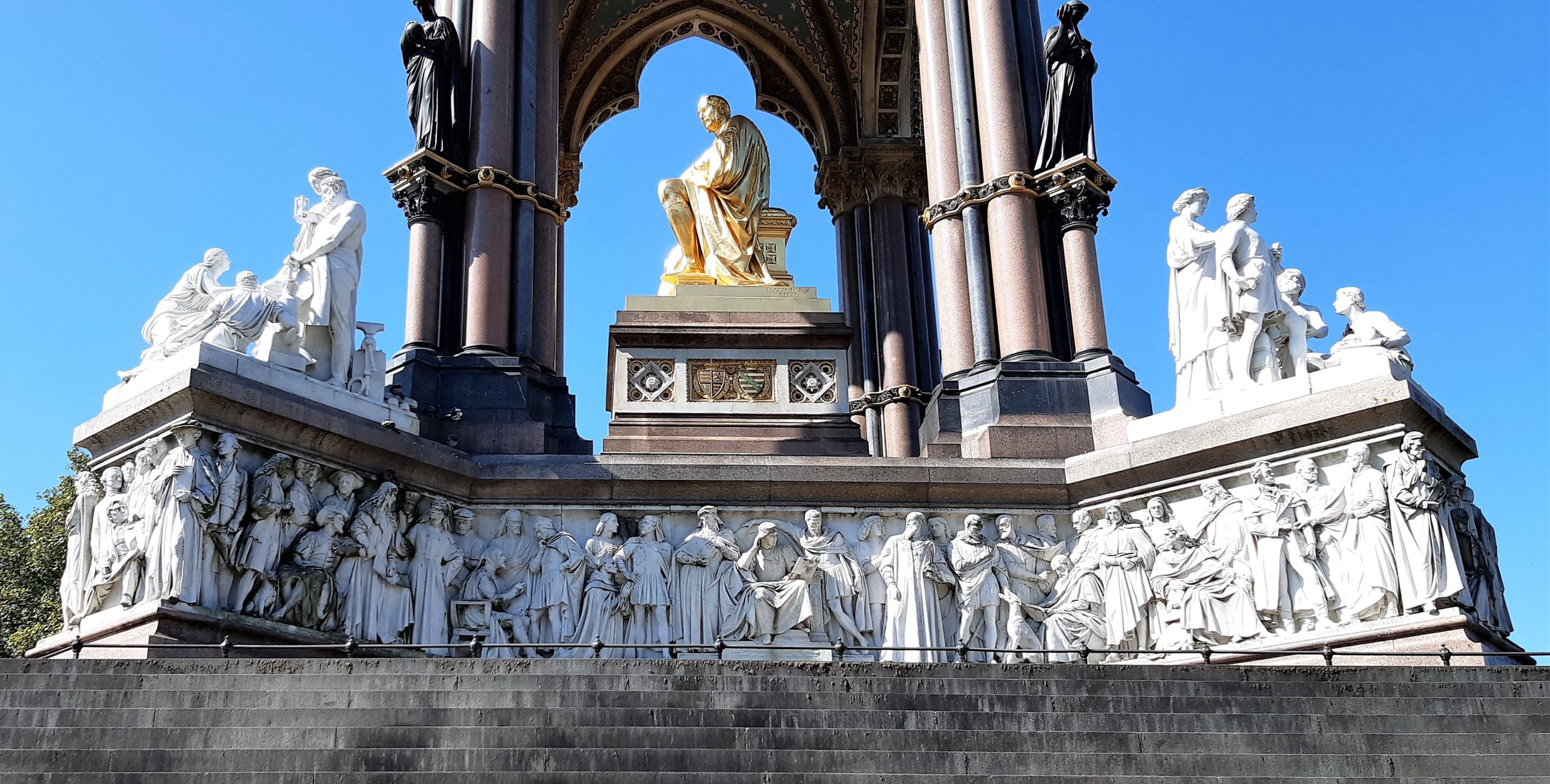 a large stone statue in front of a building