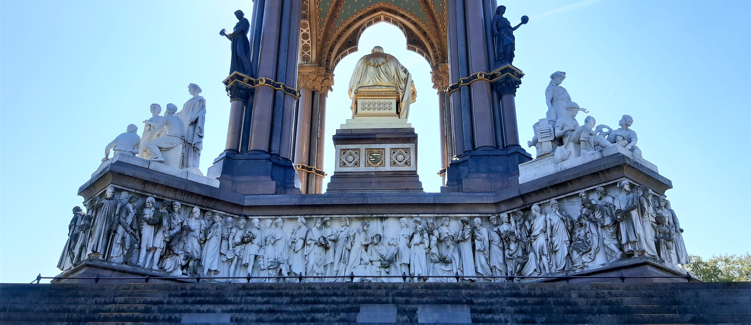 a large stone statue in front of a building