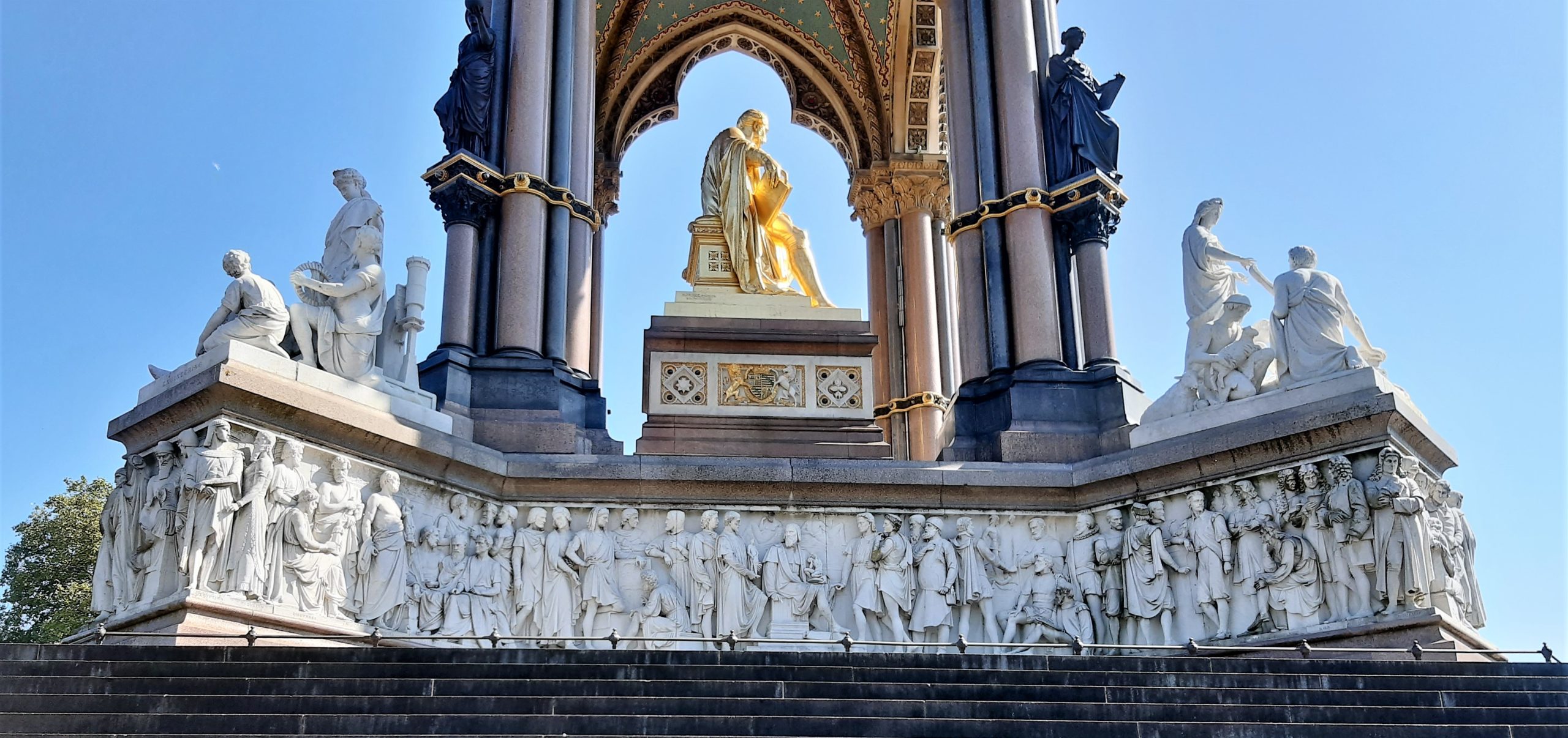 a large stone statue in front of a building