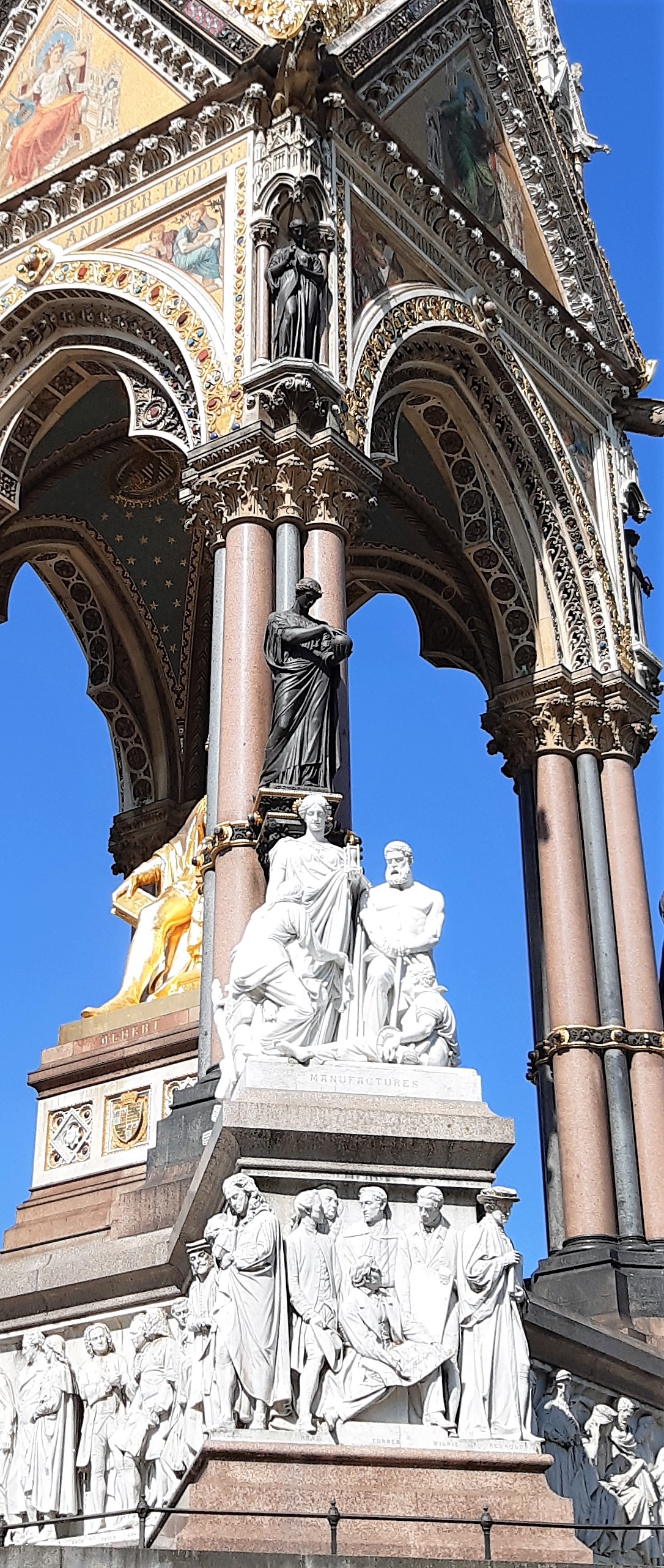 a statue in front of a building