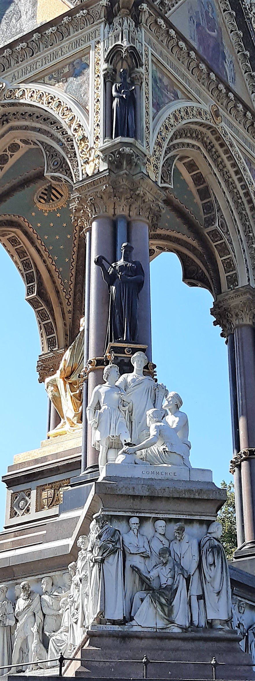 a statue in front of a building