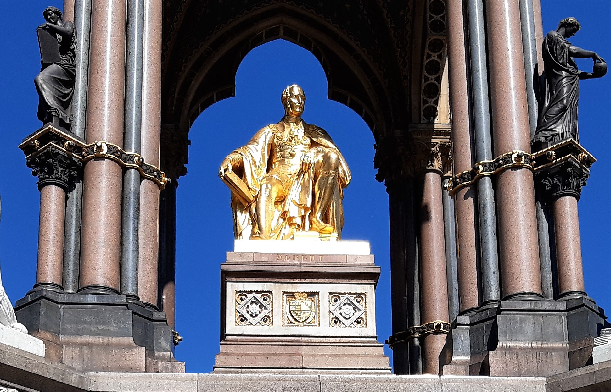 a statue in front of a building