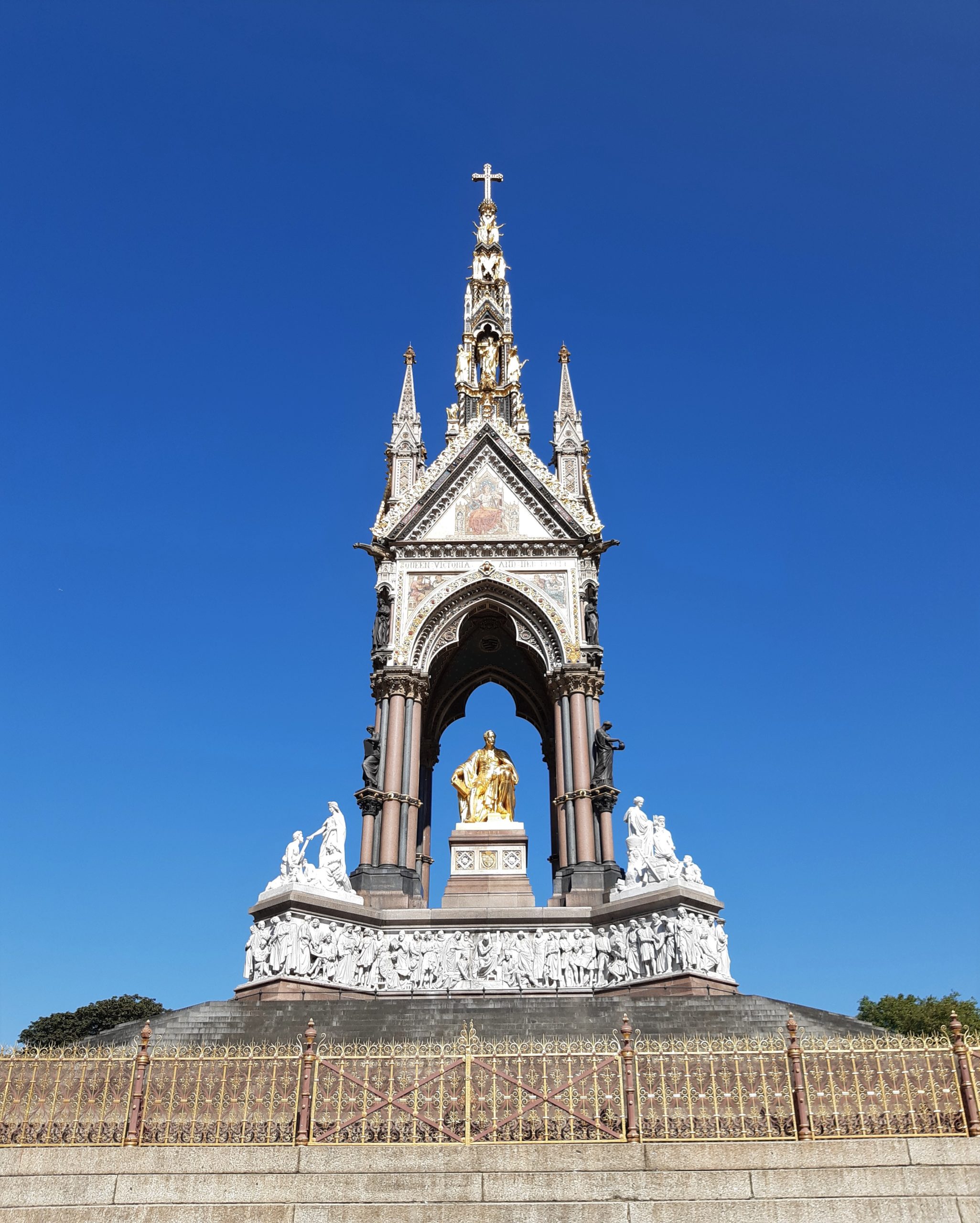 a large tall tower with a clock at the top of a building