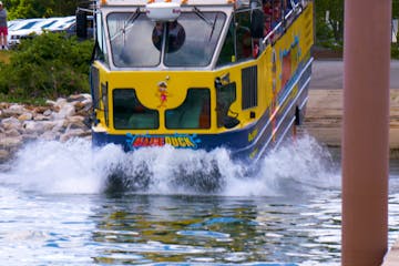 a passenger bus that is driving down the river