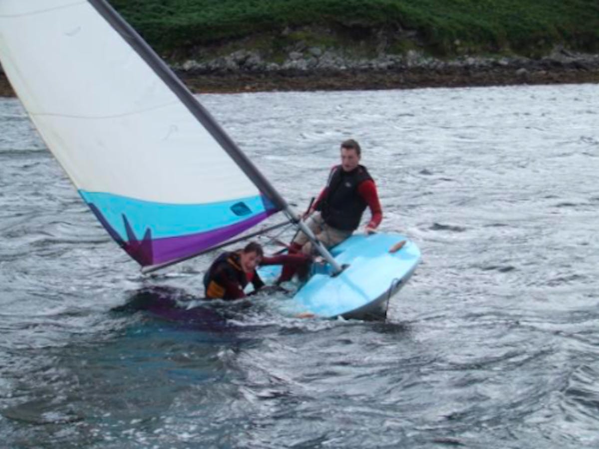 boys sailing on a Topper