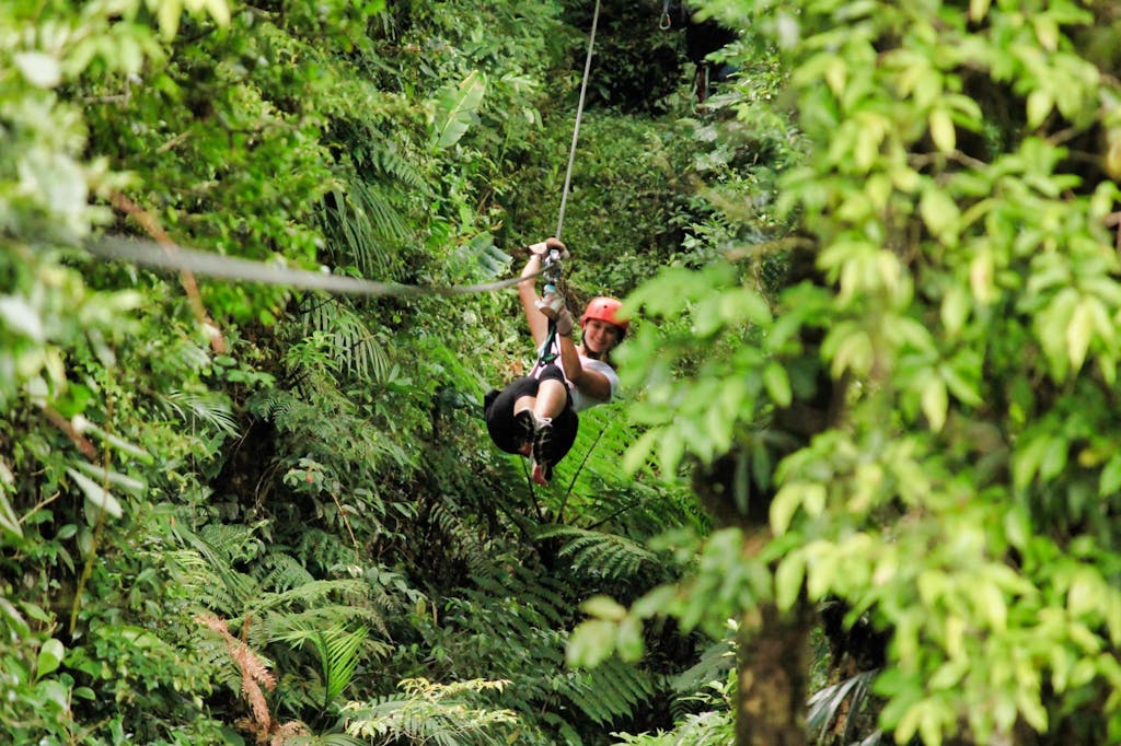 A person on a Selvatura Zip Line Through the Forest