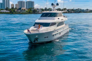 Woman on the bow of this Palm Beach yacht rental.