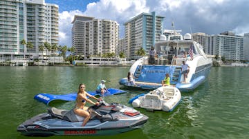 Guests enjoying the water toys of this yacht rental in North Bay Village.