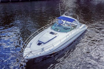A rent a boat in Miami cruising near the Miami River.