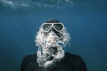person underwater doing snorkeling