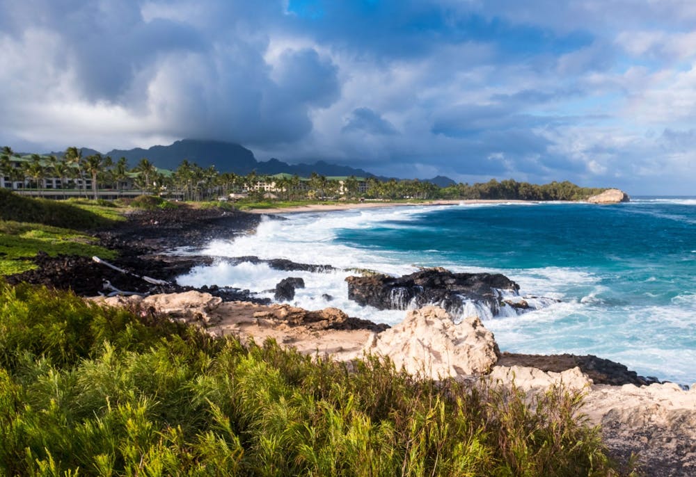 a-rocky-coastline-on-kauai-with-waves