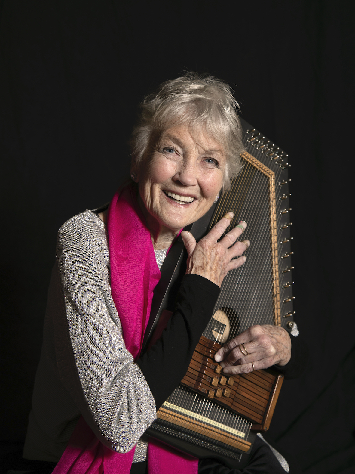 Peggy Seeger talking on a cell phone
