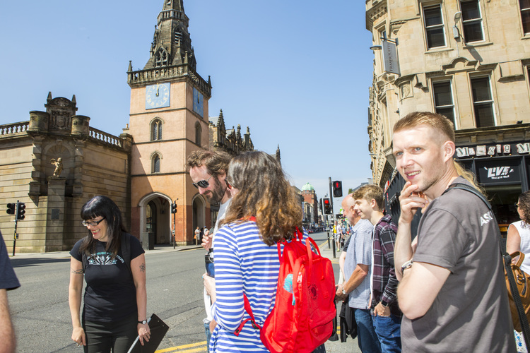 a group of people standing in front of a building