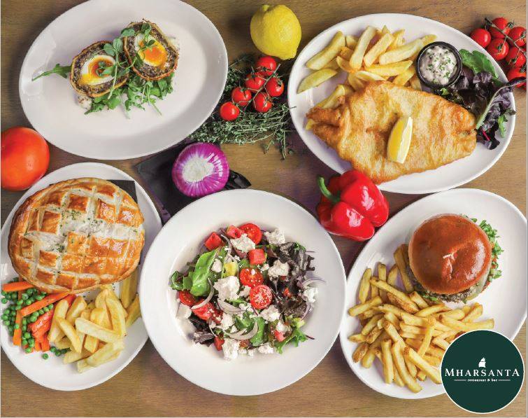 a bowl filled with different types of food on a plate