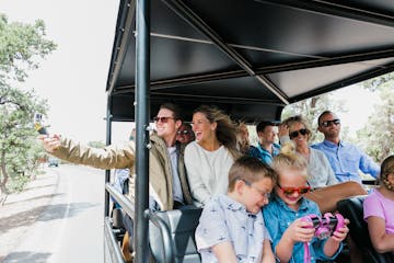 family taking a tour in a jeep