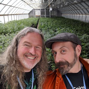 Cannabis tour guides in a pot farm greenhouse