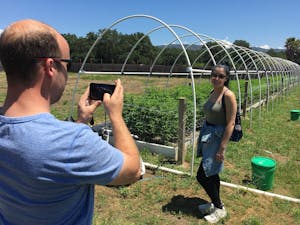 Man taking pic of woman at one of the pot farms in California's Emerald Triangle