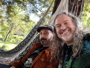 Two men in hammocks at The Solar Living Center in The Emerald Triangle