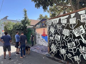 People viewing murals in the Mission
