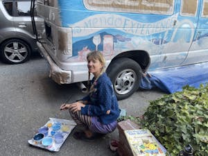 Girl painting an art van