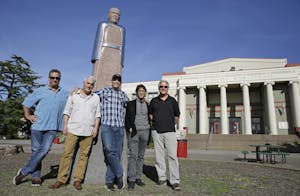 The Waldos standing in front of the statue of Louis Pasteur at San Rafael High
