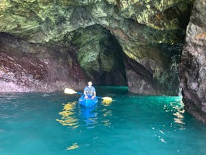 A kayaker in a sea cave