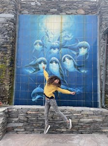 a statue of a person in a blue door