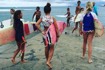 Surfer girls on the beach